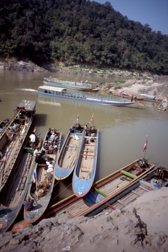 These boats serve as trucks and buses for riverside villages.